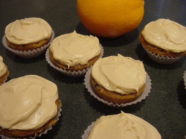 mini pumpkin spice cupcakes with raisins and pecans and a frosting of brown sugar, molasses, orange zest and cream cheese