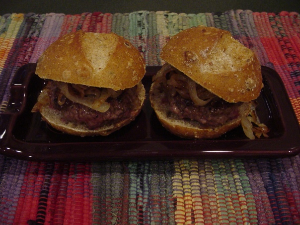 grass-fed beef sliders on multi-grain bread with caramelized onions
